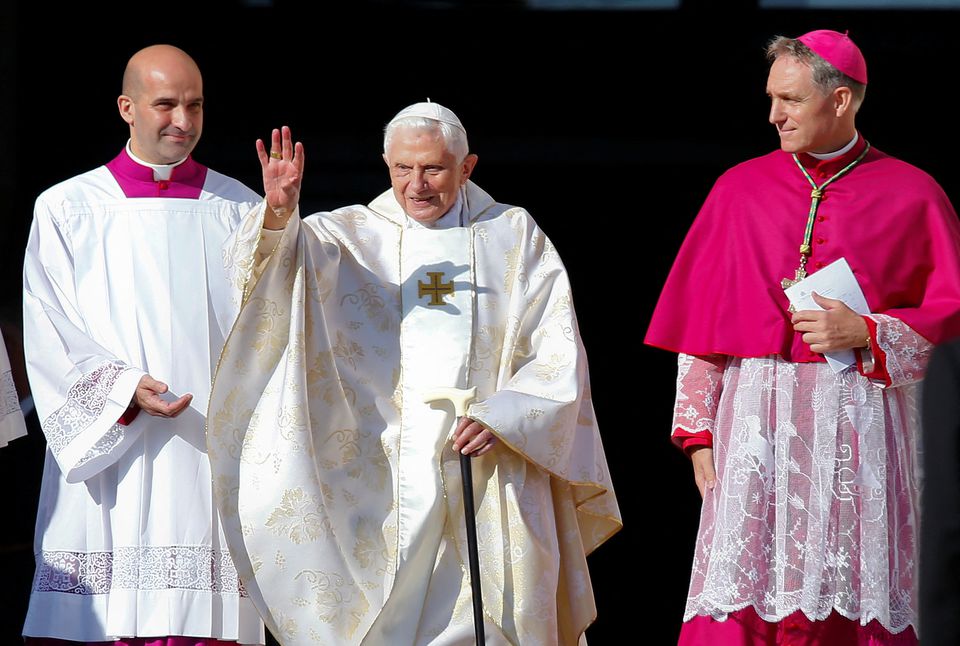 Emeritus Pope Benedict XVI waves as he arrives to attend a mass for the beatification of former pope Paul VI in St. Peters square at the Vatican October 19 2014